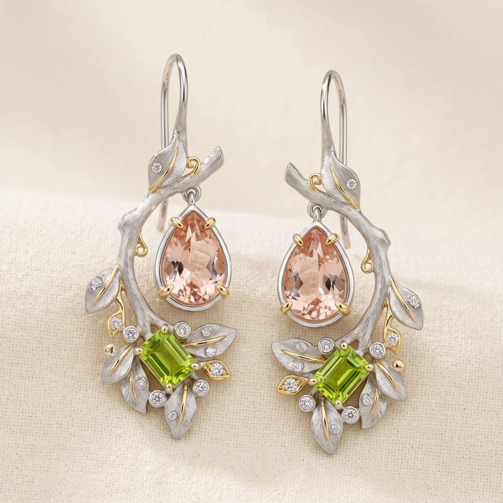 Sculptural platinum drop earrings with pear-shaped morganite, peridot clusters, and diamond accents